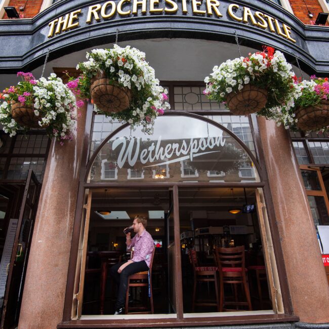 Wetherspoon cuts plans for more pubs as sales fall